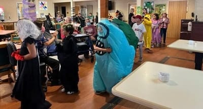 Residents and children participating in a festive activity