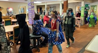 Residents enjoying a Halloween event in the common area