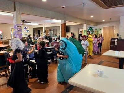 Residents participating in a themed activity in the common area