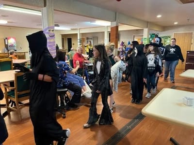 Residents and children in costumes during a celebration
