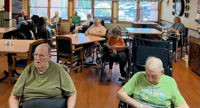 Residents sitting in a common area at the facility