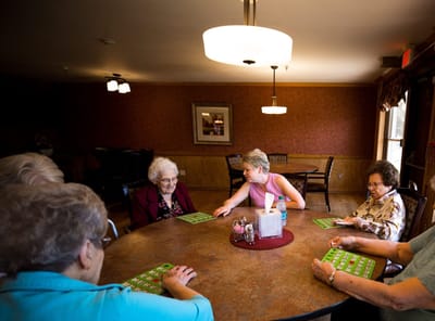 Residents playing bingo in a common area
