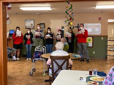 Residents enjoying a musical performance during an event