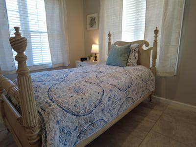 Cozy bedroom with a single bed and patterned bedding