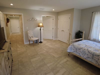 Private resident room with a bed and chair