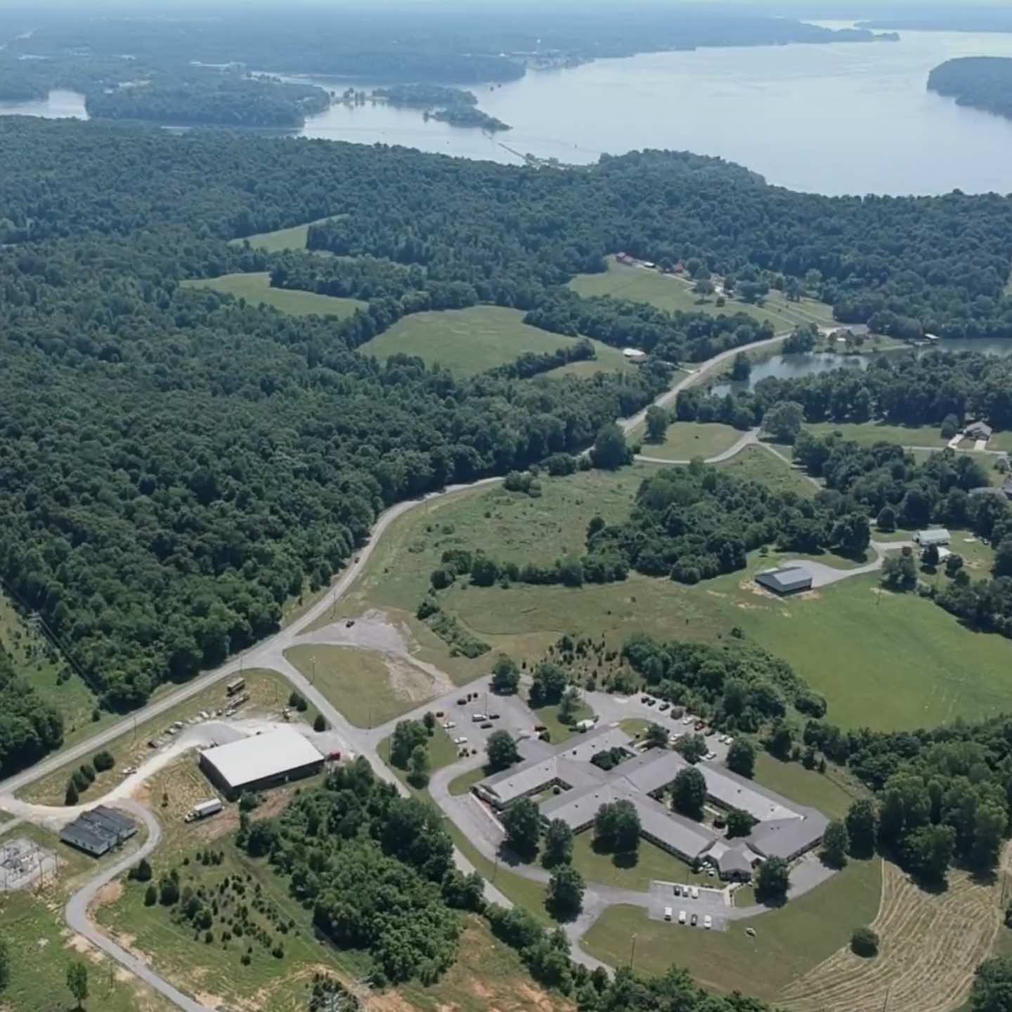 Aerial view of a senior living campus near a lake