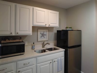 Interior kitchen space with cabinets and appliances