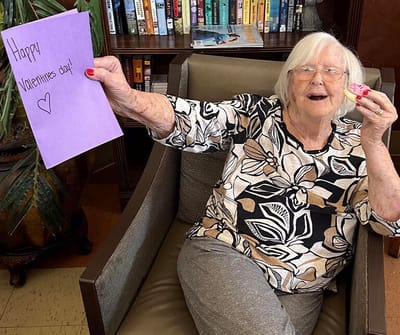 Resident celebrating Valentine's Day with a card