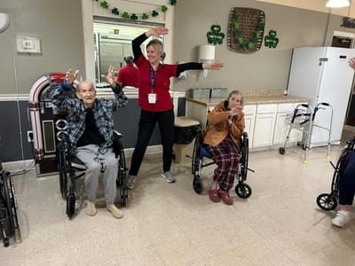 Residents and staff engaging in an activity indoors