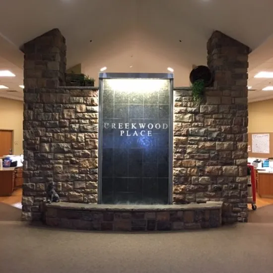 Interior entrance area with stone wall and sign