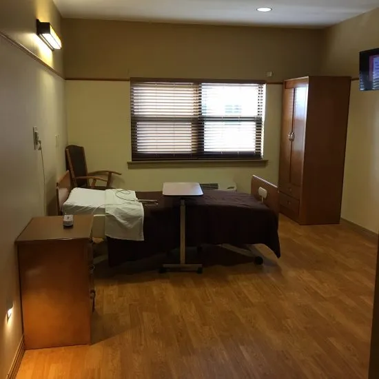 Private resident room with bed and furniture
