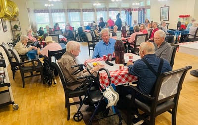 Residents enjoying a festive gathering in the dining room