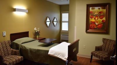 Cozy private resident room with bed and seating area