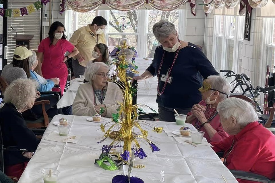 Residents celebrating a festive activity in a common area
