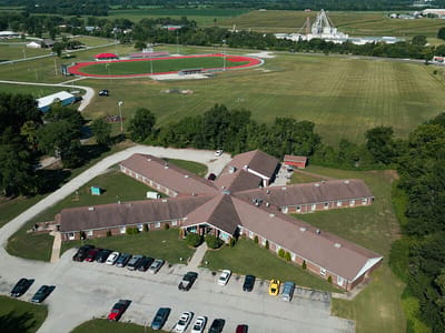 Aerial view of a senior living facility with outdoor space
