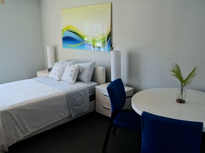 Modern resident room with bed and table