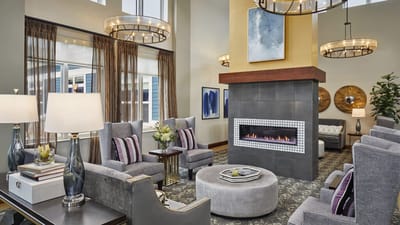 Bright common area with comfortable seating and fireplace