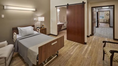 A well-furnished private resident room with modern decor