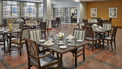 Dining area set for a meal with elegant table settings