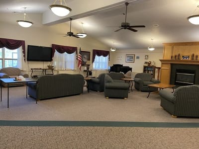Comfortable common area with seating and piano