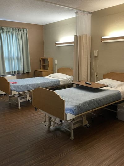 A shared resident room with two beds