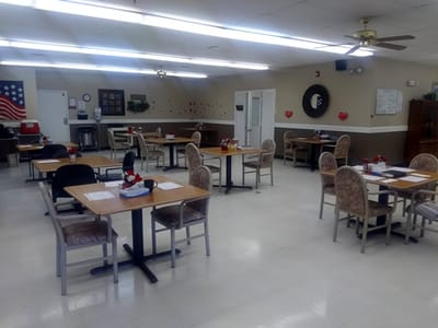 Dining room setup with tables and chairs