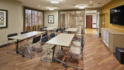 Bright activity room with tables and chairs