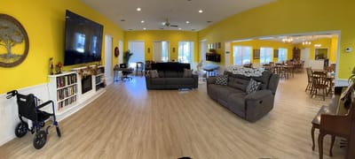 Bright common area with seating and dining space