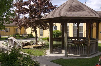 Gazebo in a landscaped outdoor area of a senior facility