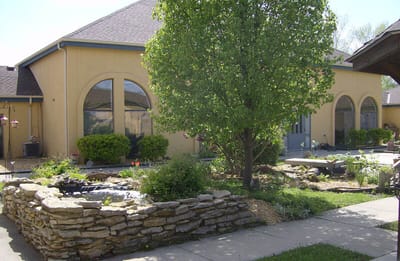 Outdoor space with green landscaping and building facade
