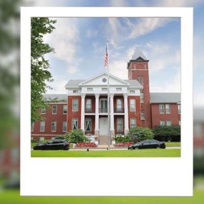 Historic nursing home building with landscaped entrance
