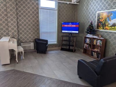 Common area with seating and a television