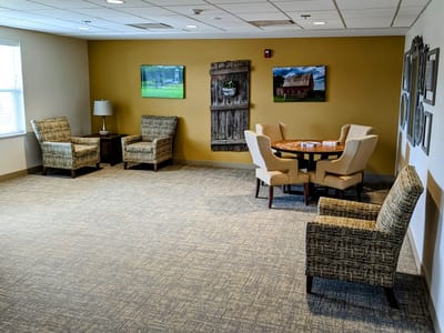 Bright common area with chairs and tables