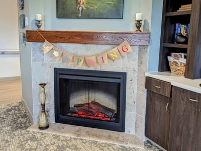 Cozy indoor fireplace with spring decorations