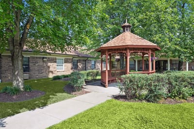 Outdoor gazebo surrounded by greenery at the facility