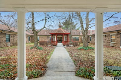 Pathway leading to a gazebo in a landscaped garden