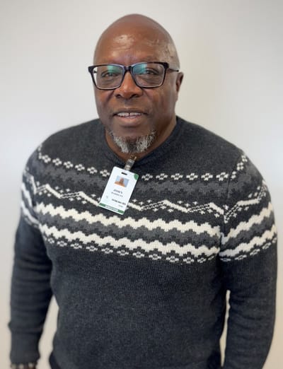 Portrait of a staff member wearing a name badge