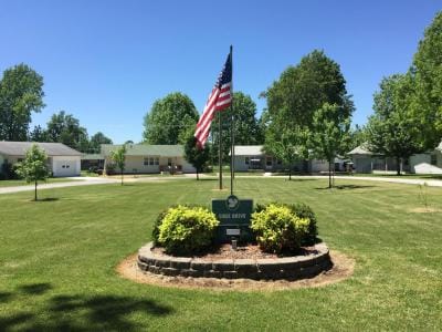 Flag and landscaped area in front of the facility