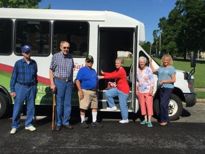 Residents and staff by facility transport bus