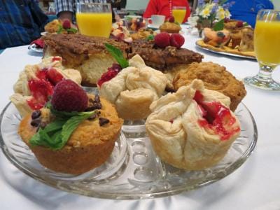 Close-up of homemade pastries and drinks at a gathering