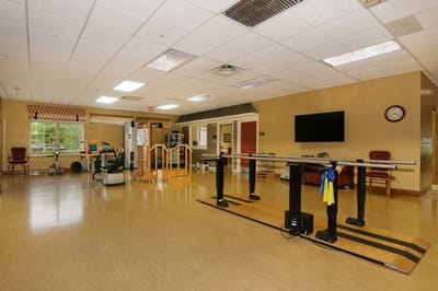 Therapy room with exercise equipment and barre