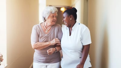A caregiver and resident enjoying a moment together