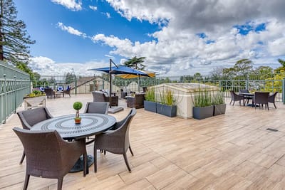 Outdoor patio with seating and umbrellas