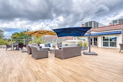 Outdoor terrace with seating and umbrellas