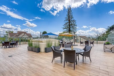 Outdoor patio area with seating and umbrellas