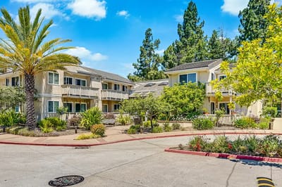 Outdoor view of a nursing home facility with gardens