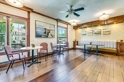 Bright common area with tables and chairs