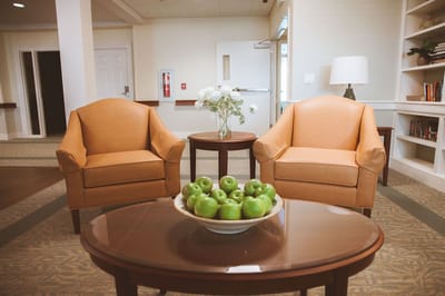 Cozy common area with chairs and a coffee table