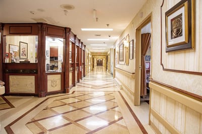 A well-lit hallway in a senior living facility