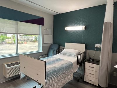 A well-furnished private resident room in a nursing facility